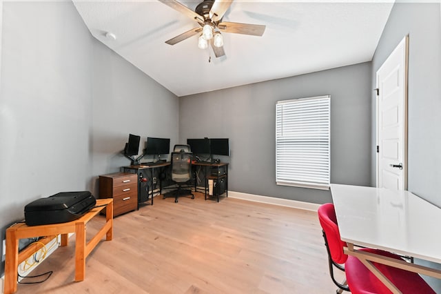 office space with light hardwood / wood-style floors, ceiling fan, and lofted ceiling