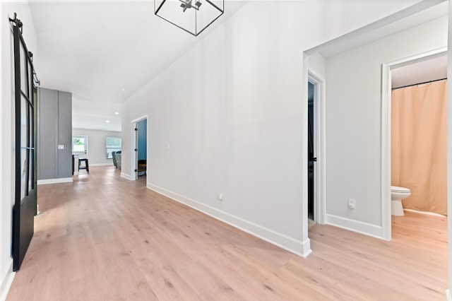 hall with light wood-type flooring