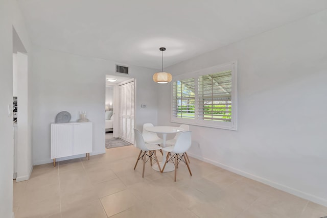 dining space with light tile patterned floors