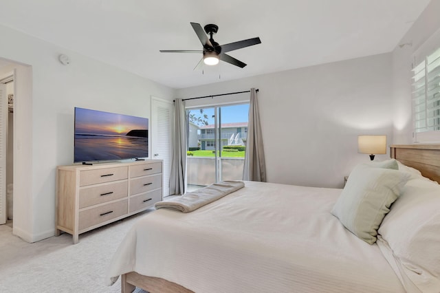 carpeted bedroom with access to exterior and ceiling fan