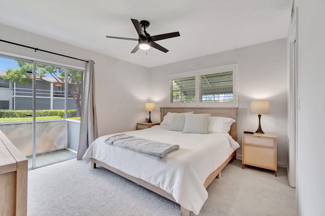 carpeted bedroom featuring access to exterior and ceiling fan