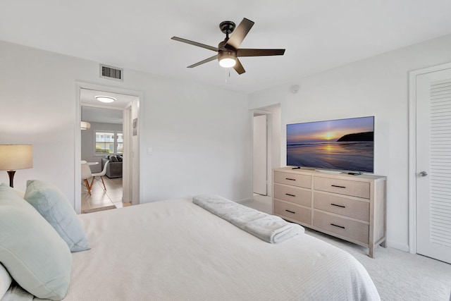 740 Horizons W Unit 105, Boynton Beach, FL 33435 - bedroom with a ceiling fan, light carpet, and baseboards