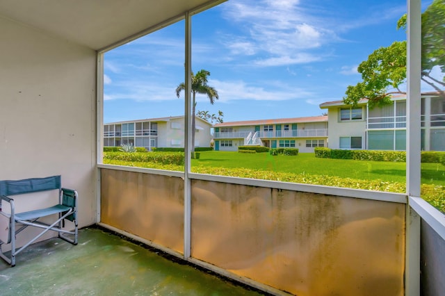 740 Horizons W Unit 105, Boynton Beach, FL 33435 - unfurnished sunroom featuring a residential view