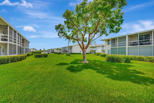 740 Horizons W Unit 105, Boynton Beach, FL 33435 - view of green lawn featuring a residential view