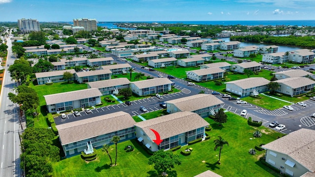 birds eye view of property featuring a water view