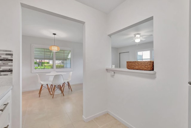 hallway with light tile patterned floors