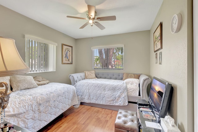 bedroom featuring hardwood / wood-style floors and ceiling fan