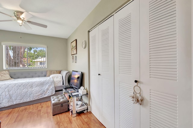 bedroom with a closet, ceiling fan, and hardwood / wood-style floors