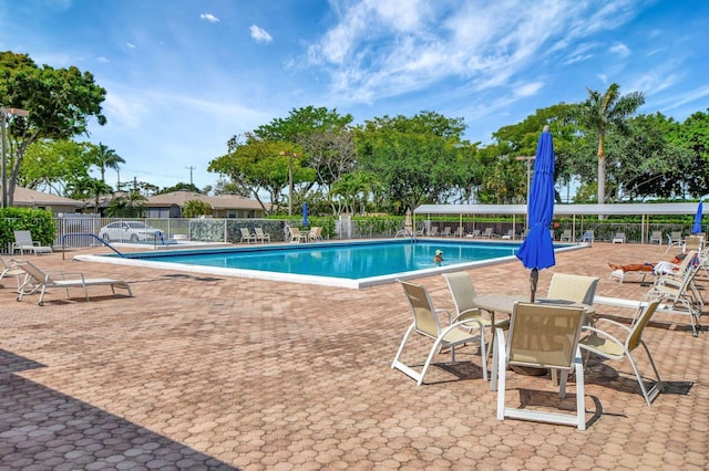 view of swimming pool featuring a patio area