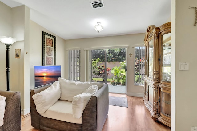 living room with light hardwood / wood-style flooring