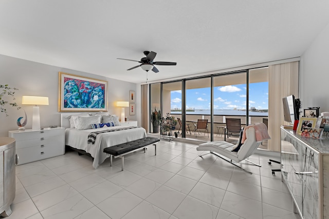 bedroom featuring expansive windows, access to exterior, light tile patterned floors, and ceiling fan