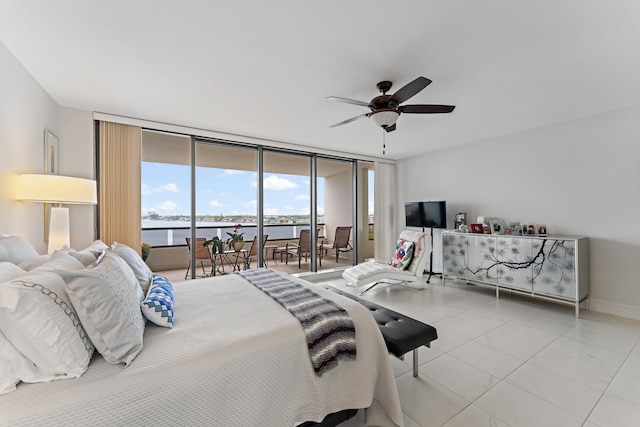 tiled bedroom featuring access to exterior, expansive windows, and ceiling fan