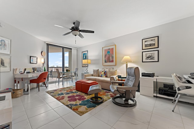 tiled living room with ceiling fan and a wall of windows