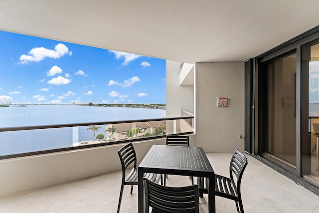 balcony featuring a water view