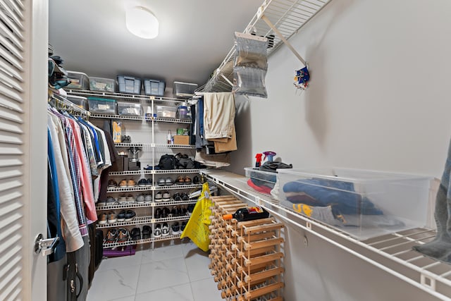 spacious closet with tile patterned flooring