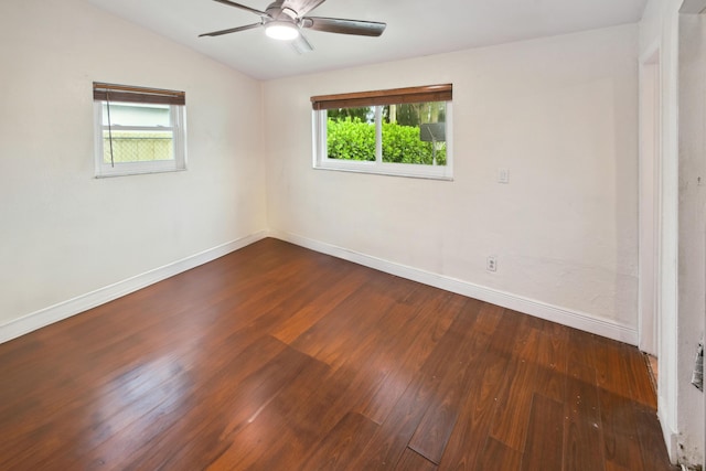 unfurnished room featuring dark wood-type flooring, lofted ceiling, and ceiling fan