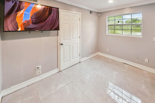 unfurnished bedroom featuring crown molding