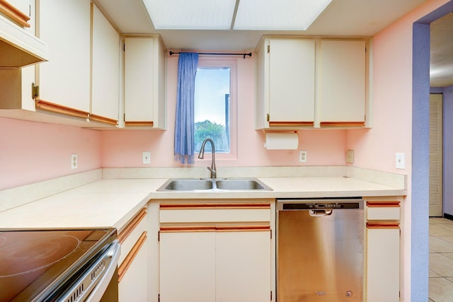 kitchen featuring sink, light tile patterned floors, dishwasher, white cabinetry, and range hood