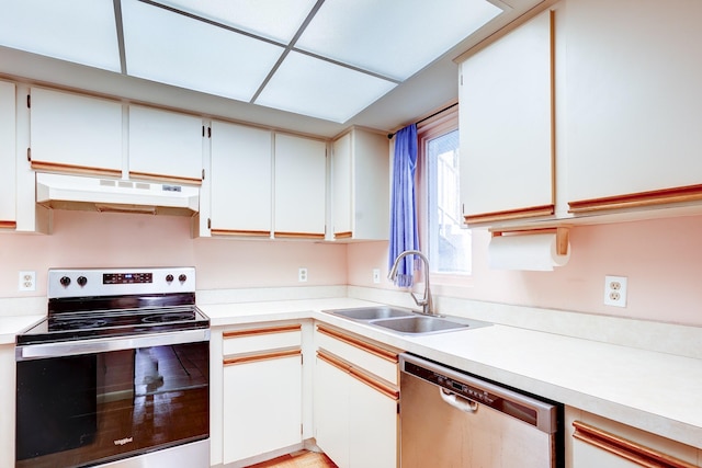 kitchen with white cabinetry, appliances with stainless steel finishes, and sink