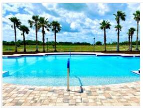 view of pool with a beach view