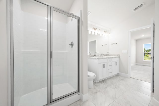 bathroom featuring vanity, toilet, walk in shower, and lofted ceiling