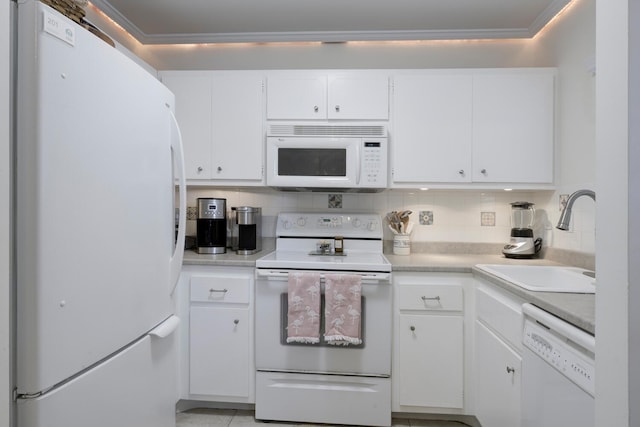 kitchen with decorative backsplash, white appliances, ornamental molding, white cabinets, and sink