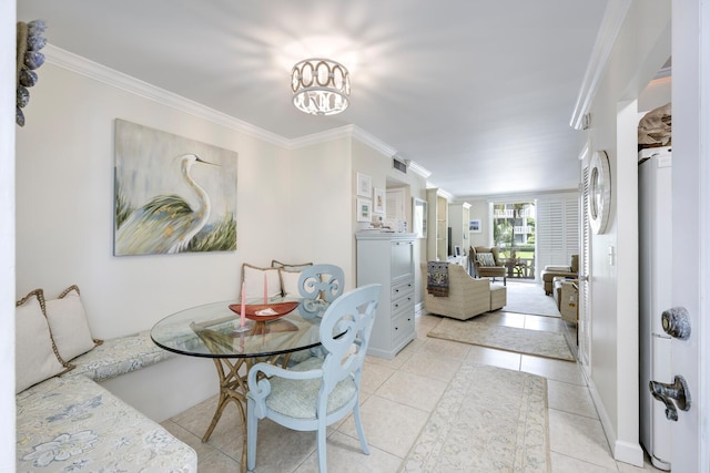 tiled dining area with an inviting chandelier and crown molding