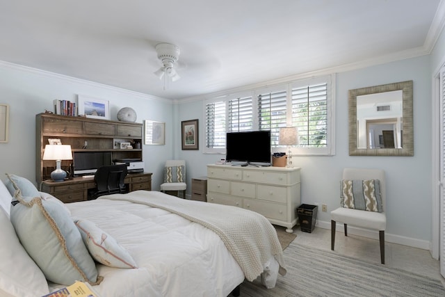 bedroom with ceiling fan and ornamental molding