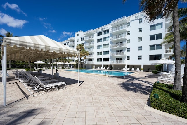 view of swimming pool featuring a patio area