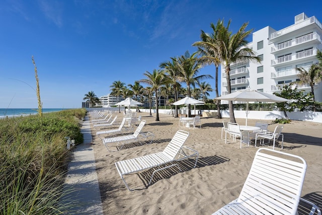 surrounding community with a gazebo and a water view