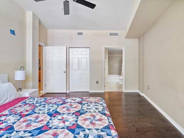 bedroom with ensuite bath, a closet, wood-type flooring, and ceiling fan