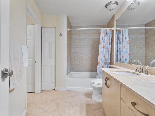 full bathroom with shower / bath combo with shower curtain, vanity, tile patterned flooring, and toilet