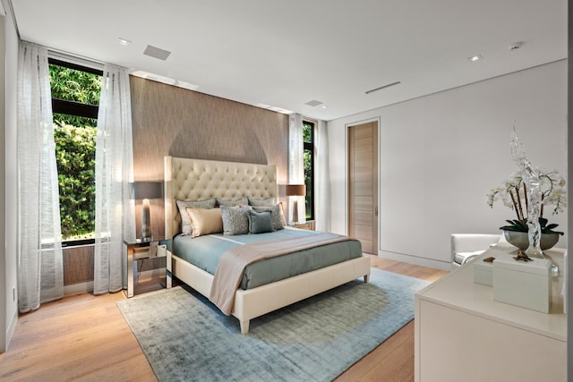 190 NE 5th Ave, Boca Raton, FL 33432 - bedroom with multiple windows, floor to ceiling windows, light wood-style flooring, and recessed lighting