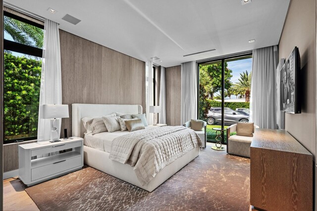 bedroom with floor to ceiling windows