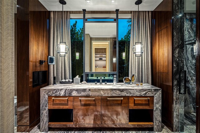 bathroom featuring vanity and a shower