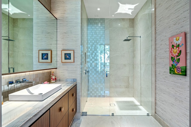 190 NE 5th Ave, Boca Raton, FL 33432 - bathroom with tile walls, a stall shower, and vanity