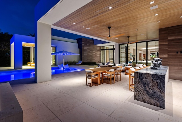 view of patio featuring an outdoor pool and outdoor dining space