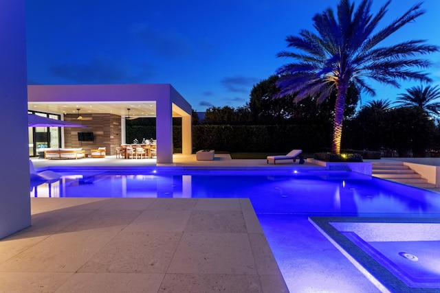 view of swimming pool featuring an outdoor living space, a patio area, and ceiling fan