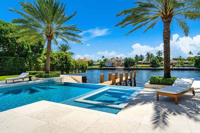 view of swimming pool with a water view and an in ground hot tub