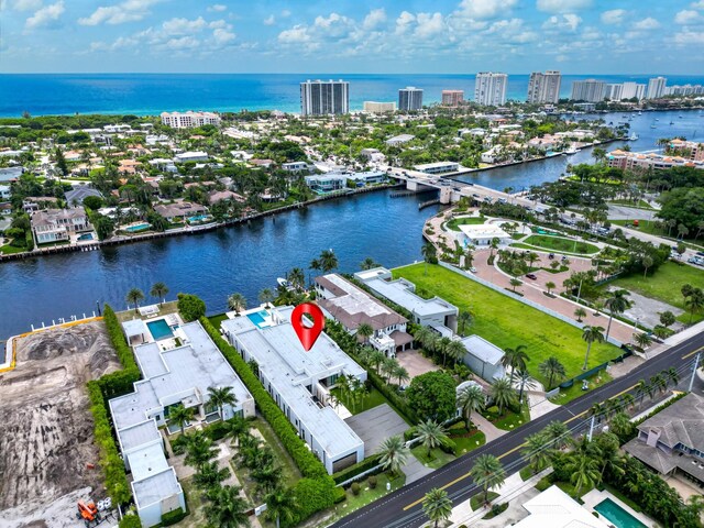 birds eye view of property with a water view