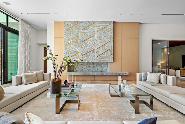 living room featuring floor to ceiling windows