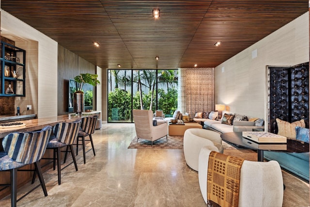 living room with expansive windows and wooden ceiling