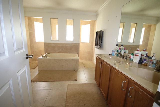 bathroom with tiled tub, tile patterned floors, crown molding, and double sink vanity