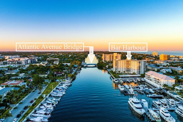 aerial view at dusk with a water view