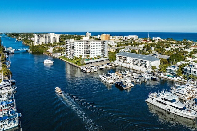 bird's eye view featuring a water view and a city view