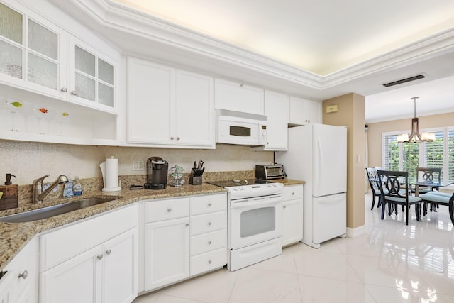 kitchen with white cabinets, white appliances, a chandelier, and sink