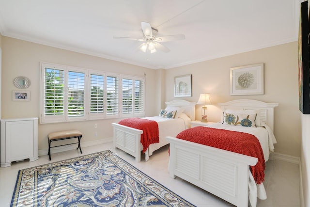 bedroom featuring ceiling fan and crown molding