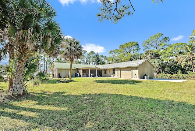 exterior space featuring a front lawn and a garage