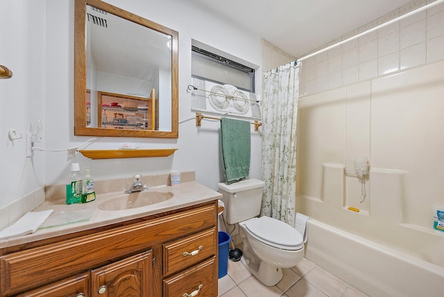 full bathroom featuring shower / bath combo with shower curtain, tile patterned floors, vanity, and toilet