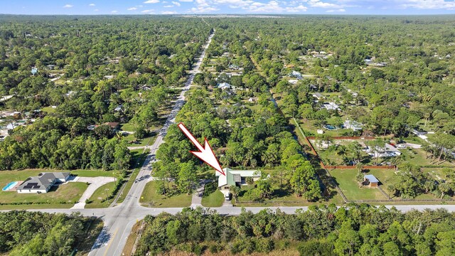 drone / aerial view featuring a forest view